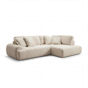 Polstergarnitur als Ecksofa mit Ottomane rechts in Stoff Dessin 389/55 mit Kissen